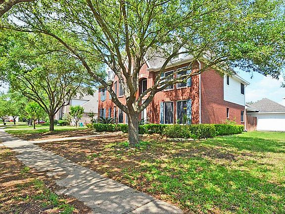 This home sits on a huge corner lot on a serene tree-lined street.