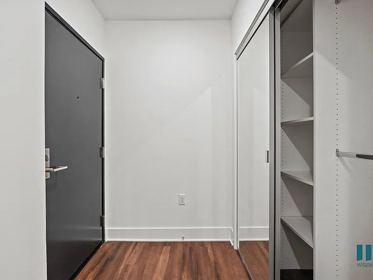 Front Entrance with Hall Closet with Built-In Shelving