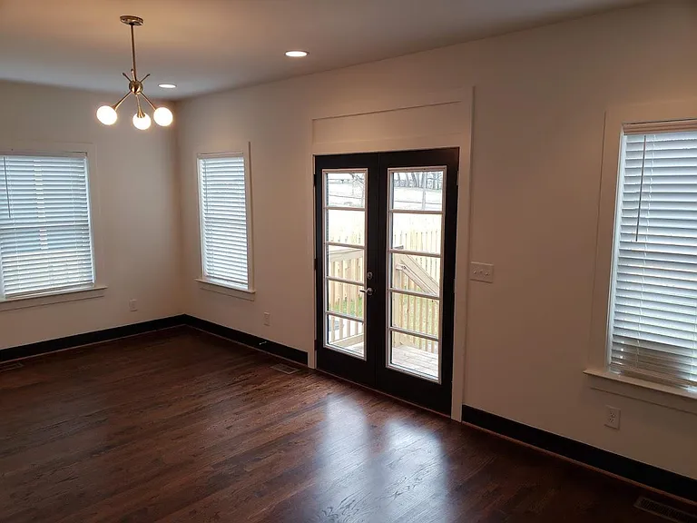 View of rear French doors in LR looking out into back yard