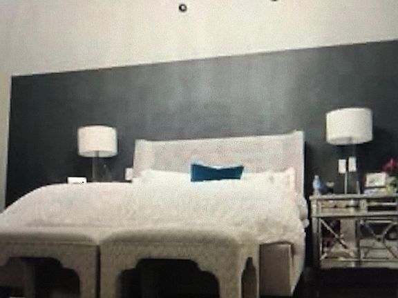 Master Bedroom with beautiful vault ceiling and chandelier.