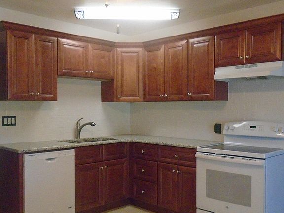Kitchen with Granite counter tops and solid wood cabinets