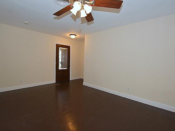 Beautiful hardwood floors are refinished and given a dark stain.