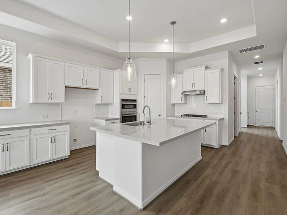 Kitchen. Sample product photo. Actual exterior and interior selections may vary by homesite. Photo m