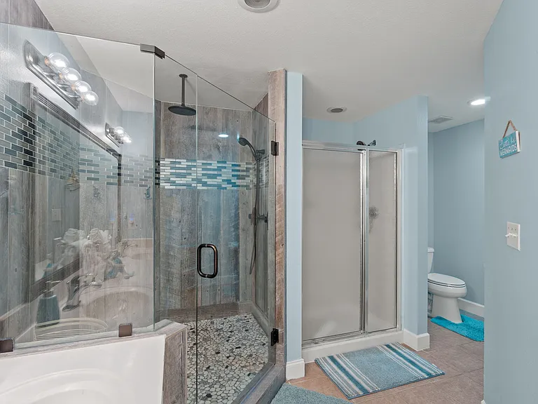 The master bathroom has a toilet and shower.