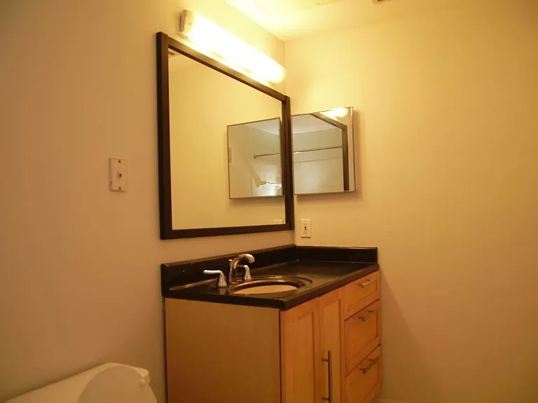 Lots of storage in bathroom cabinet.