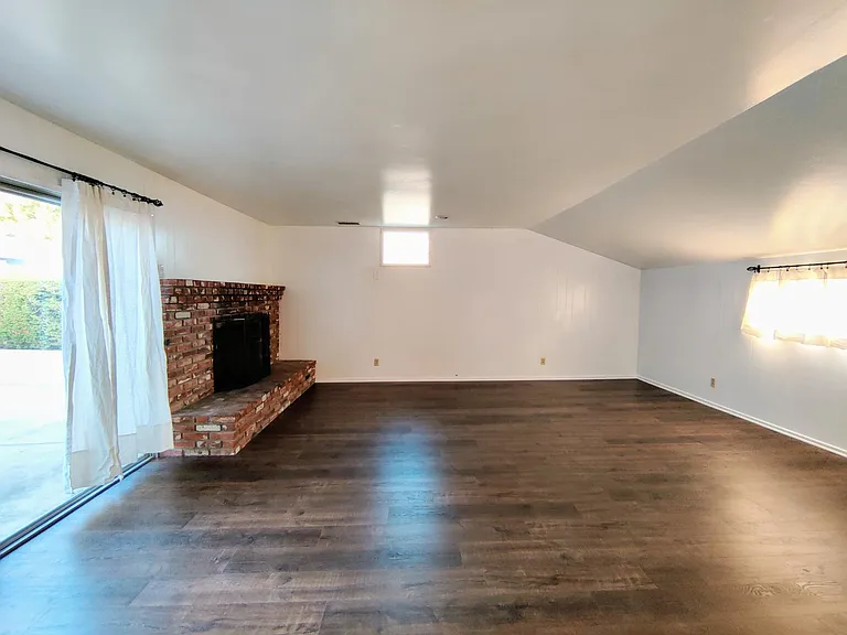 Gathering room with laminated hardwood floor.