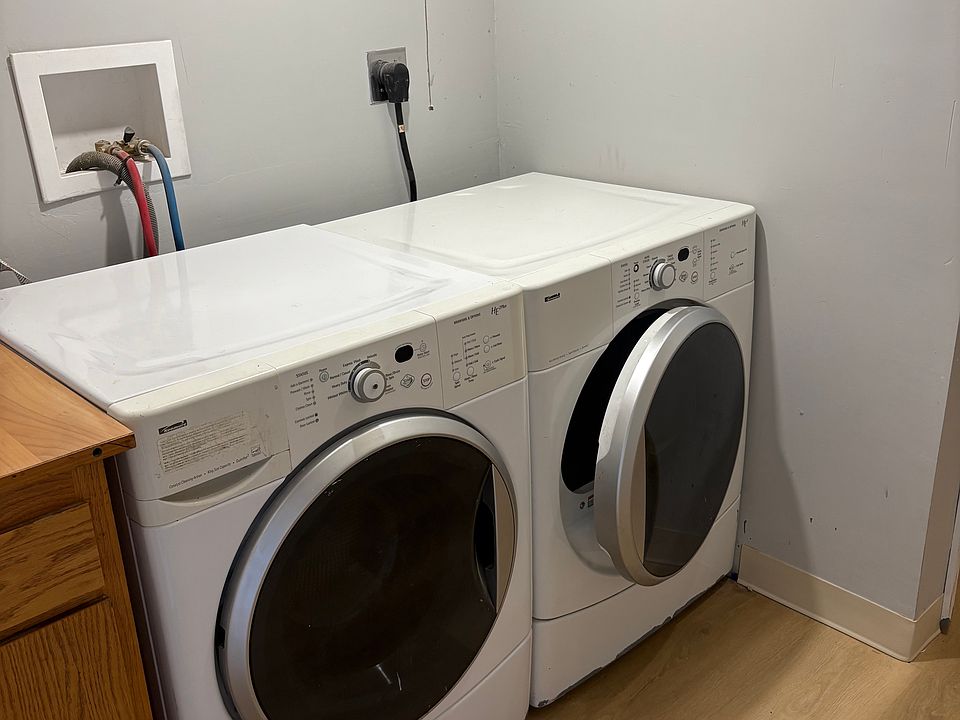 Private washer and dryer in entryway outside the apartment