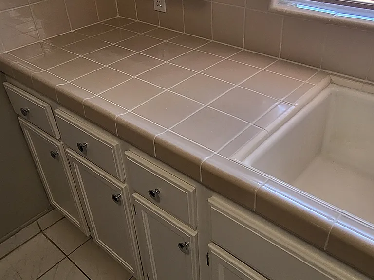 Kitchen - Clean, re-grouted tile.