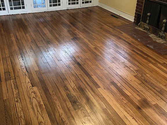 Living room with built in cabinets and FP