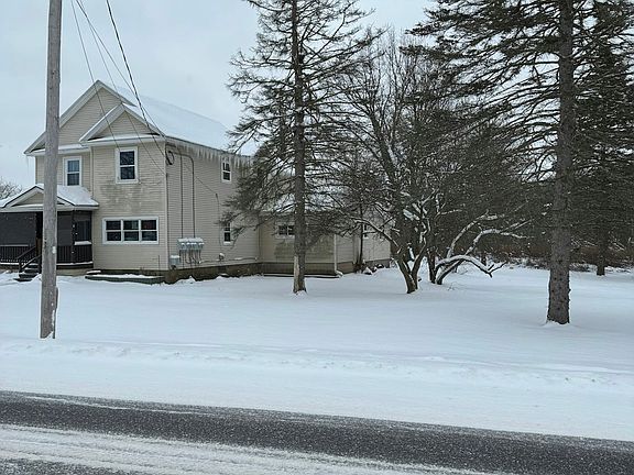Outside of the house with side yard