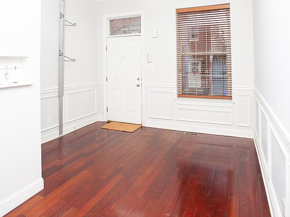 The front door enters to either a space for a dining room table or sitting area. Space has a closet for your coats, a key holder, and a bike rack that holds two bikes!