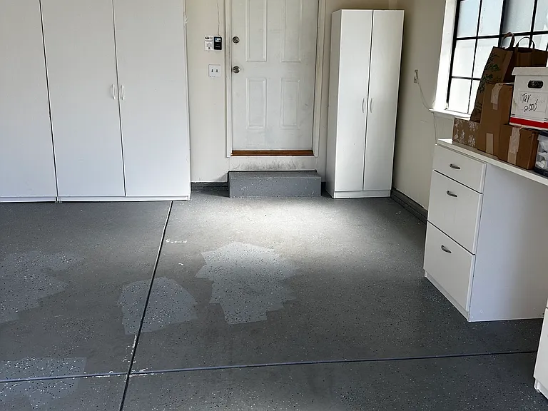Garage area with cabinetry. Door leads to your homes entrance.