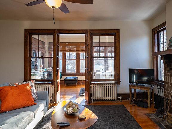 Sun porch with classic french doors is off the living room on the front of the house and adds a nice extra living space.