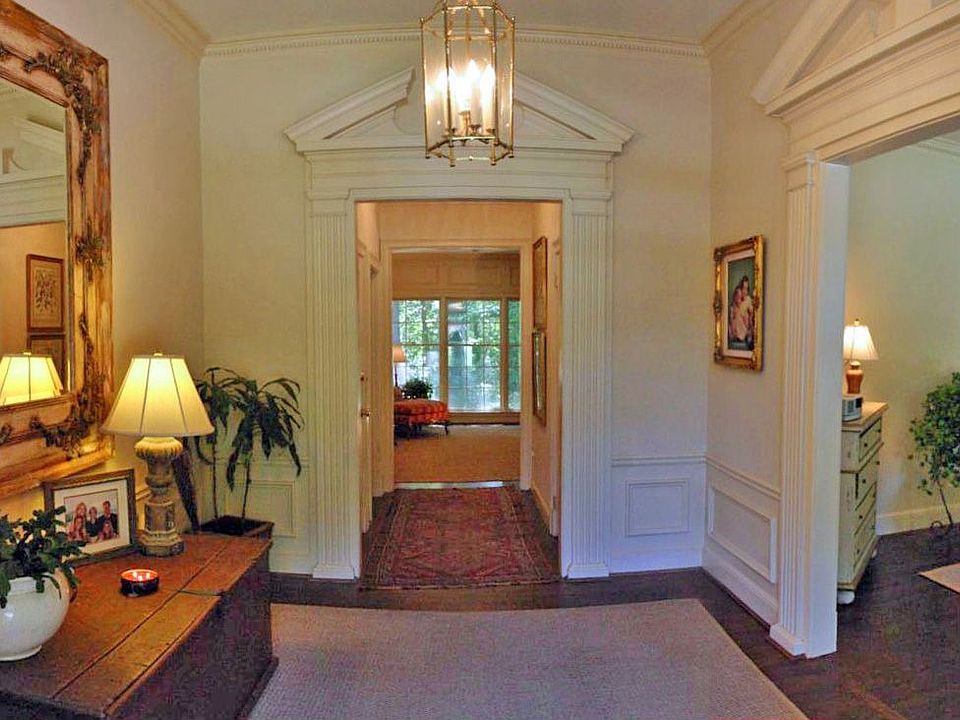 Huge, dramatic foyer with unique interior pediments and heavy modlings