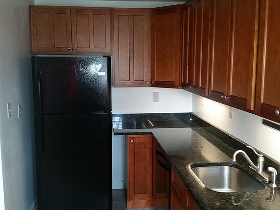 Granite countertop. Lazy susan in corner cabinet. Under cabinet lighting.