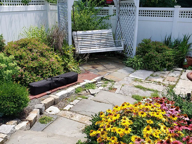 Front yard with swing.