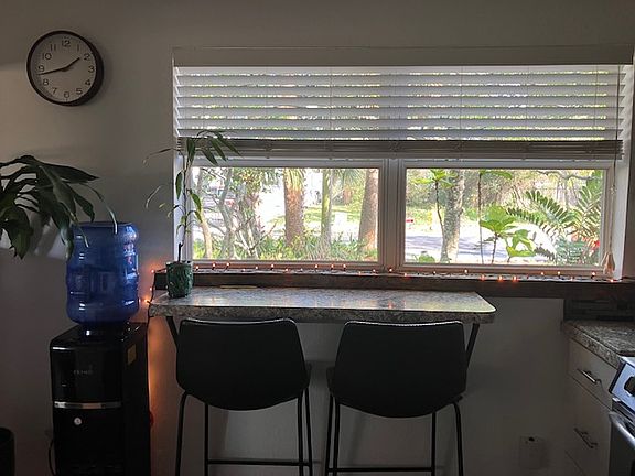 Kitchen counter, water cooler and view toward street.