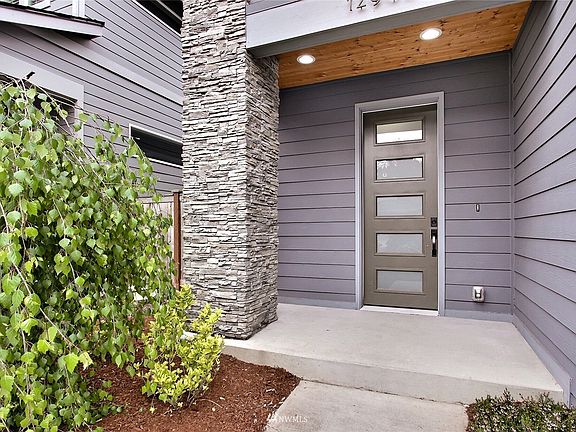 Covered entry way with an oversized front door.