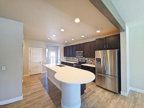 4th image of 10005 E 59th Ave