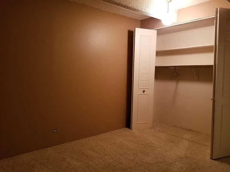 Second bedroom, which displays huge closets, which are all through the apartment.