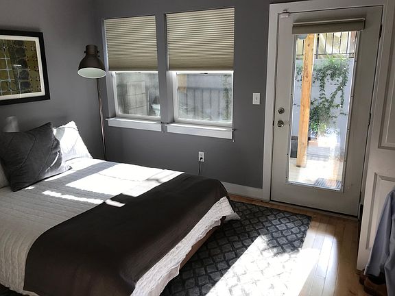 Bedroom w/ morning light (and darkening blinds)