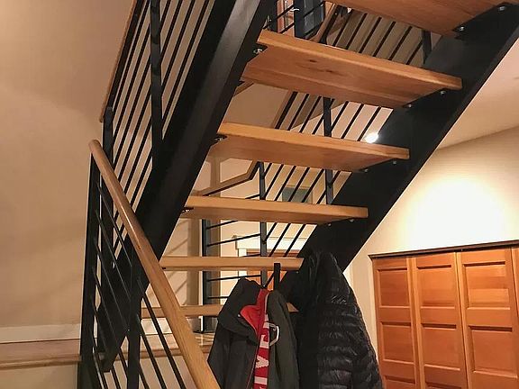 Steel staircase with hickory wood stairs.