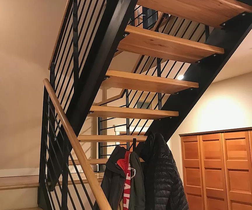 Steel staircase with hickory wood stairs.