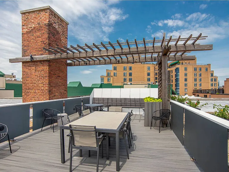 Rooftop Deck with Lounge Seating and Pergola Dining