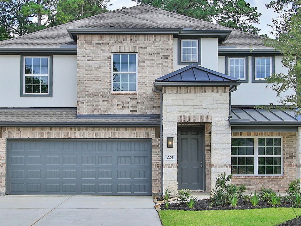 Elegant brick and stone facade, metal roof, exquisite landscaping in tranquil Woodlands Hills settin