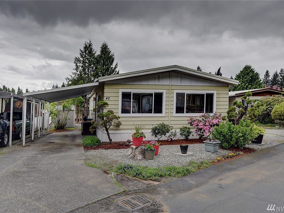 Mature landscaping and ample parking. 