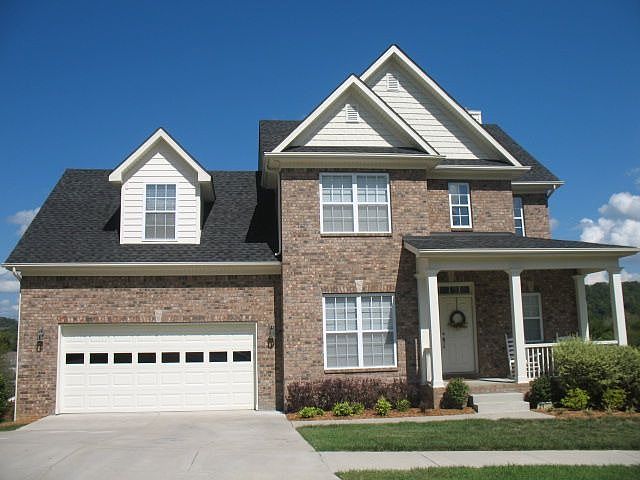 This beautiful all brick home is located in very popular Riverwalk in Bellevue