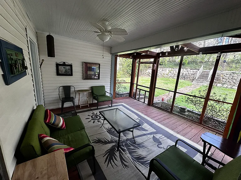 The screen porch in the front is a favorite place to hang out.