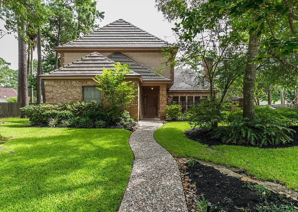 Spectacular family home with mature trees and aluminum roof.
