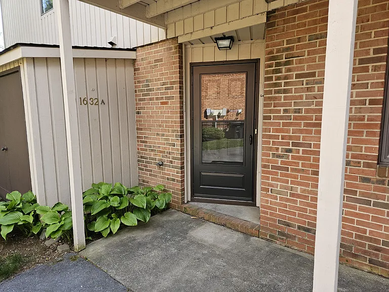 Front door has storm/screen door.