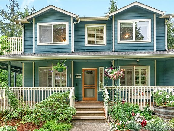 Inviting wrap-around front porch to greet your guests.