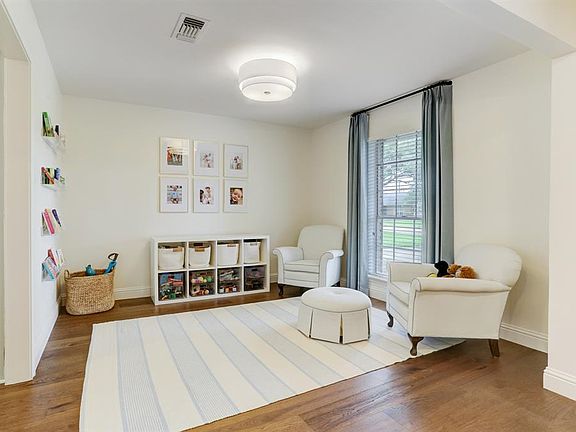 Currently being used as a play room. Could be a home office or formal sitting room. Drapes are excluded