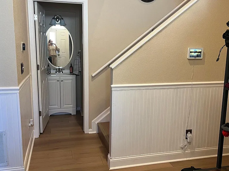 Staircase upstairs and lower bathroom