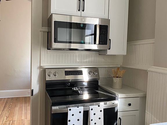 New cabinets, stove and microwave.