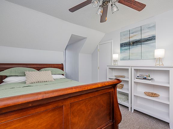 Upstairs queen bedroom with walk-in closet and work space