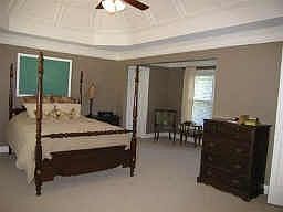 Trey ceiling highlights the grand master bedroom