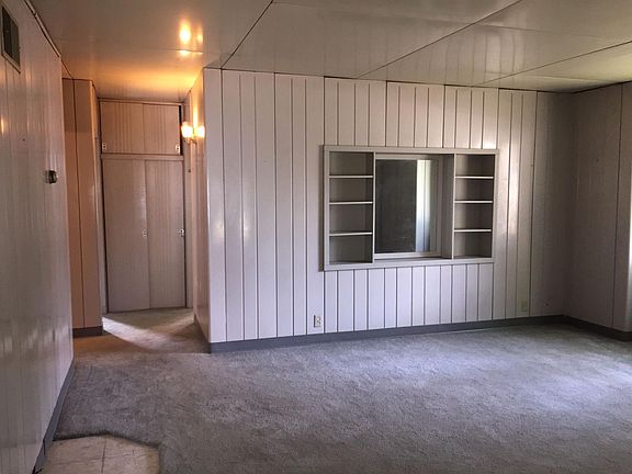 Living room, hall towards bedrooms on left