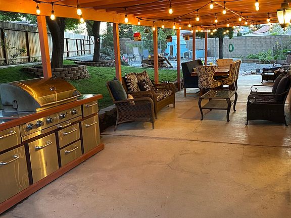 Covered patio and five large trees offers an abundant amount of shade to keep you cool.