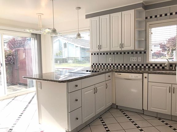 Updated kitchen that leads to yard