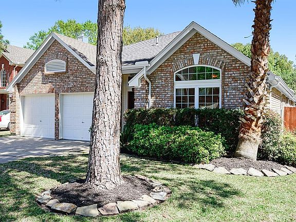 Located in a cul de sac this property showcases mature trees as well as a landscaped front lawn