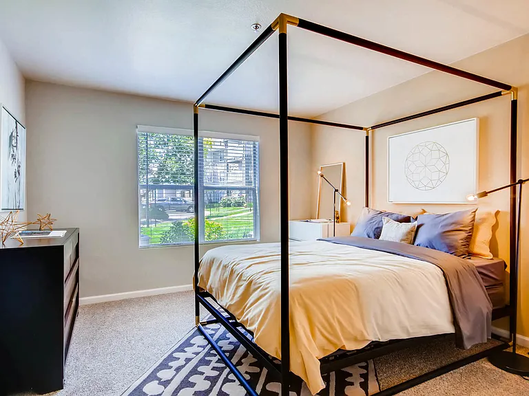 A bedroom at Eagles Landing at Church Ranch Apartments