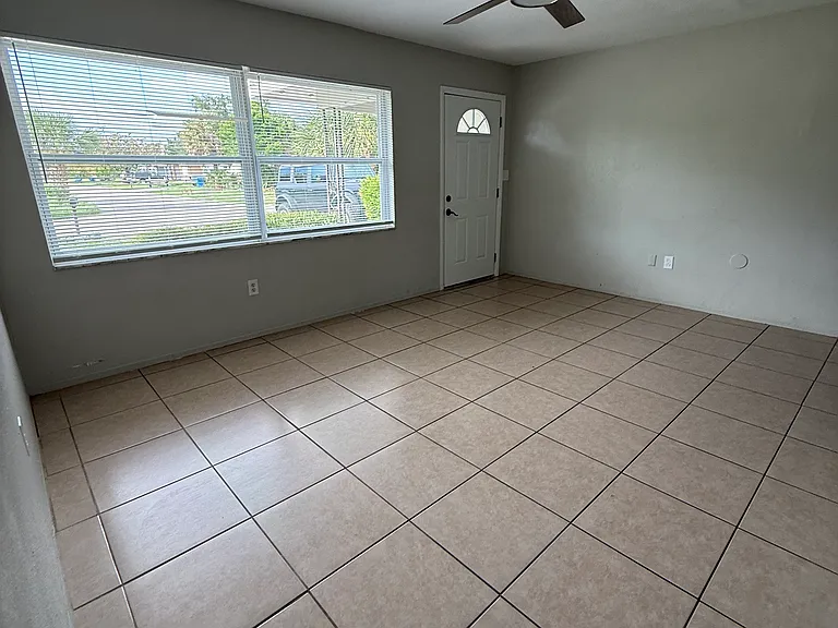 Family room looking from the bedroom area toward the front door.