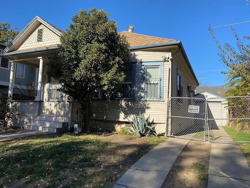 Front with driving way and garage