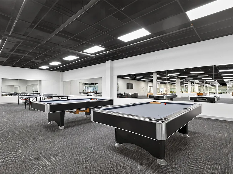 Huge Game Room with Billiard Tables, Ping Pong Tables & Shuffle Board at University Plaza NIU Apartments