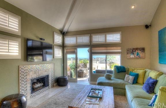 Great room is enhanced by custom fireplace plus designer paint and decor.