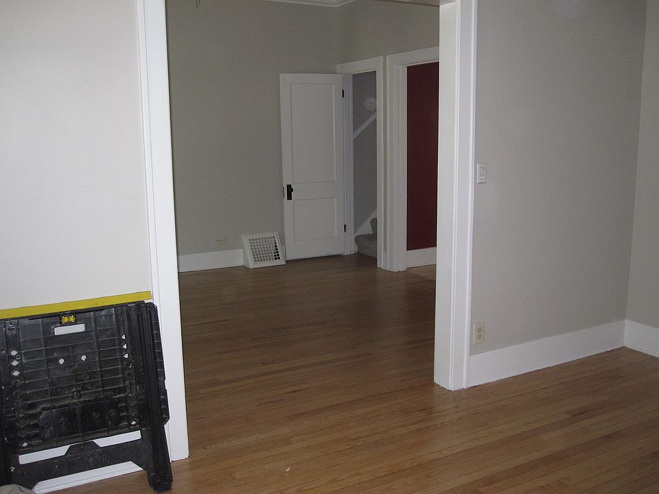 This is the large living room and large dinning room with 9' foot ceilings and heavy crown moldings. This picture is looking from the front door showing part of lining & dinning to the stairs going to the 2nd floor and kitchen. All floors are hard wood.